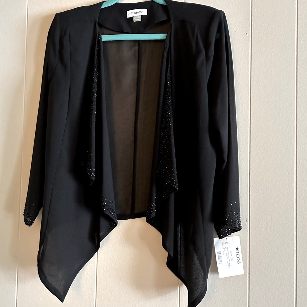 Black Calvin Klein dressy jacket.  Bought it for a wedding but never used it